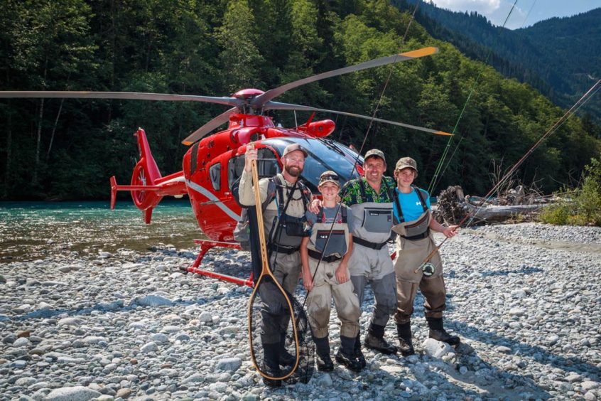 Father and sons on a heli-fishing trip