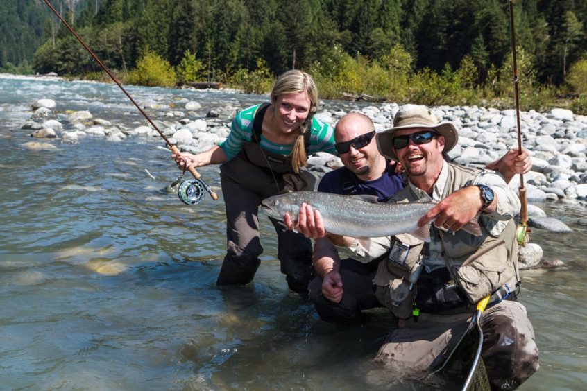 Fly fishing for salmon and trout on a past heli-fishing trip