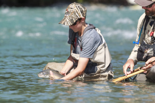 Young Angler with a nice Bull Trout - Heli-Fishing